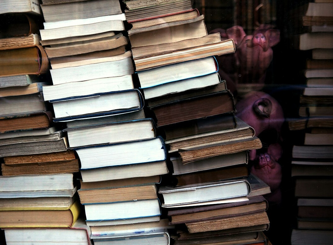 Stack of old books with worn covers