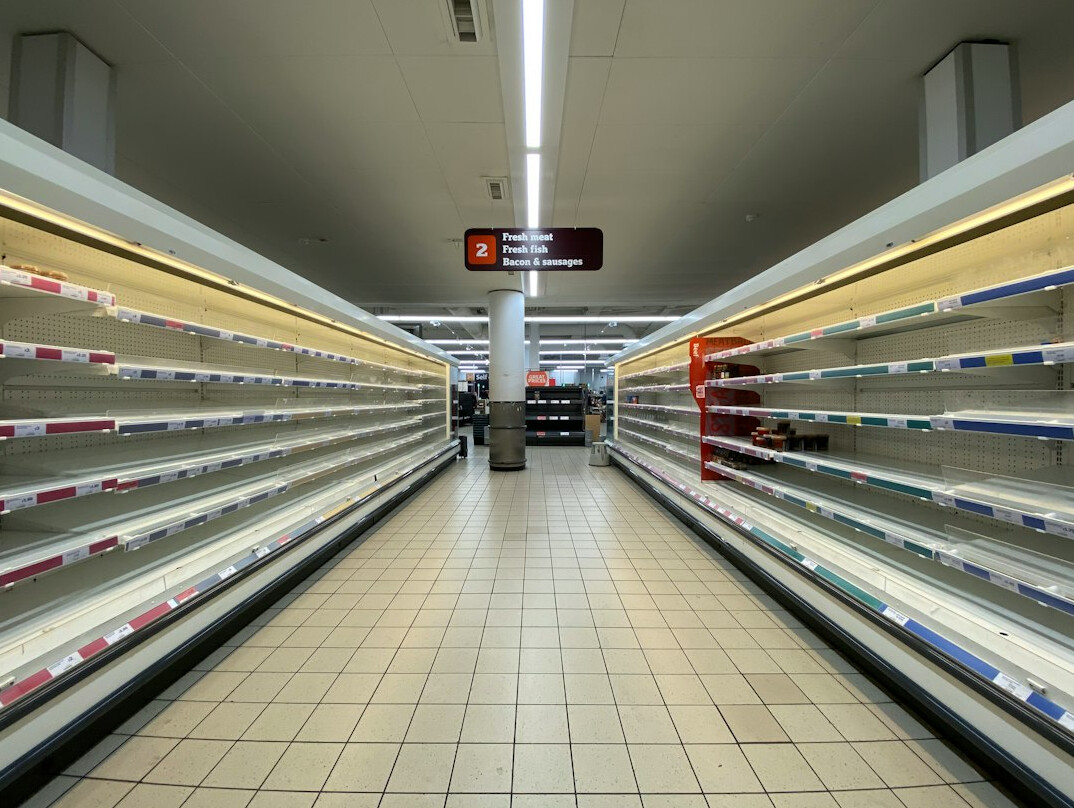 store security guard monitoring aisles